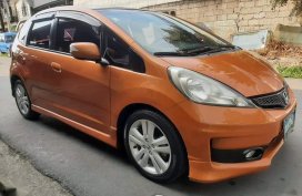 Orange Honda Jazz 2013 for sale in Quezon City