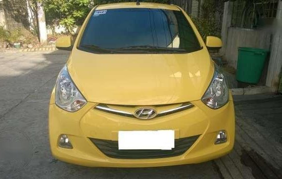 2015 yellow Hyundai Eon GLS mirage kia rio manual picanto mazda
