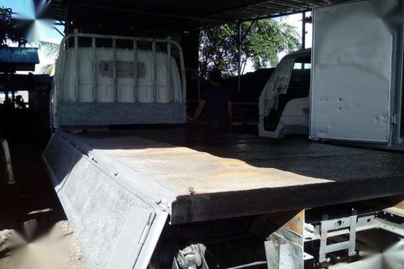 Isuzu Elf 14ft drop side with lifter