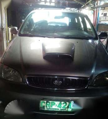 Kia carnival mazda familia rayban