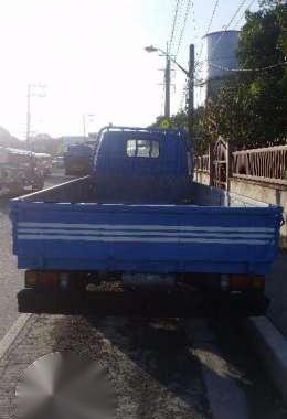 Isuzu ELF 14ft dropside flat bed truck slightly negotiable