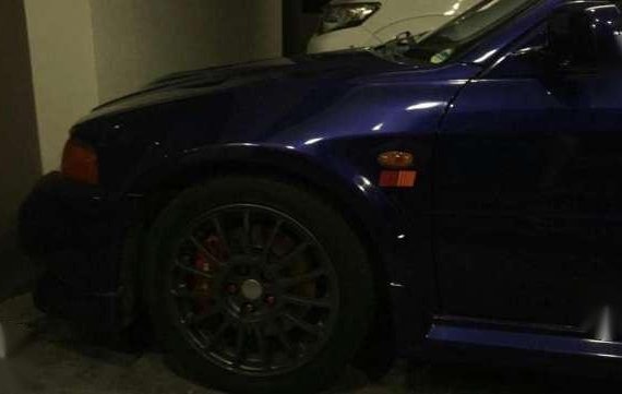 Mitsubishi Evolution sedan blue for sale 