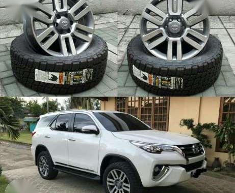 Toyota 4runner oem wheels 20x8. Nitto terra 265 50 20 tires.