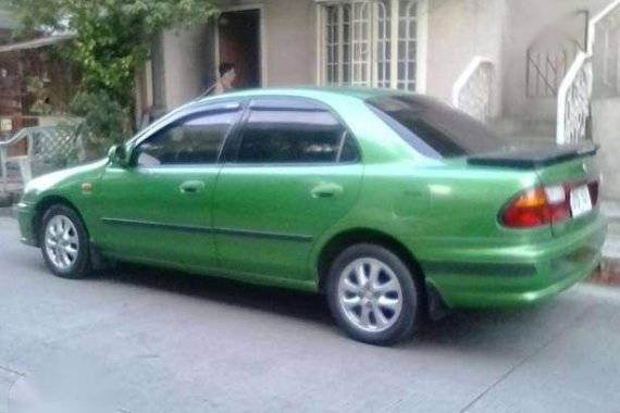 Selling my Mazda 323 Familia 97 Mdl for sale 