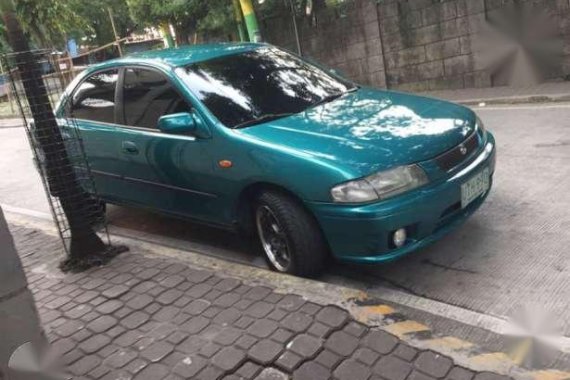 Mazda 323 Familia 1997 MT Green For Sale 