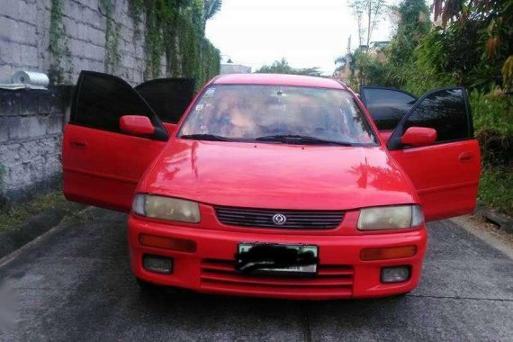 Mazda 323 Familia 1996 red for sale