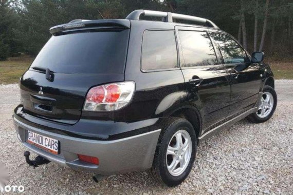 Looking for 2004-2005 Mitsubishi Outlander AT