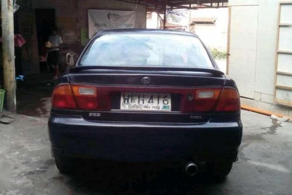 Fresh Mazda 323 1998 model AT Blue For Sale 