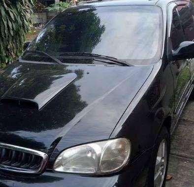 kia grand carnival 2002 blackvan for sale 