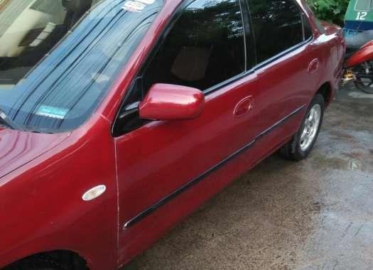 Selling lady driveN Mazda Familia 323 1996 