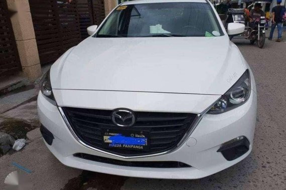 2016 Mazda 3 1.6L A/T. Arctic White color.