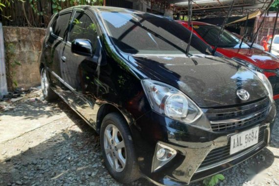 Selling Black 2014 Toyota Wigo in Marikina