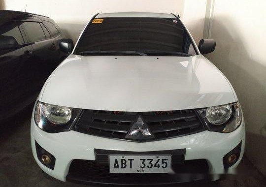 Selling White Mitsubishi Strada 2014 for sale in Pasig