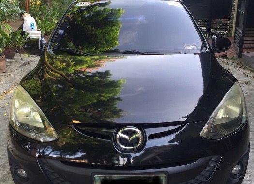 Black Mazda 2 2010 Sedan at 134000 km for sale