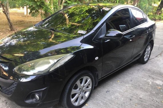 Black Mazda 2 2010 Sedan at 134000 km for sale