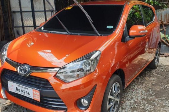 Selling Orange Toyota Wigo 2019 Manual Gasoline in Quezon City