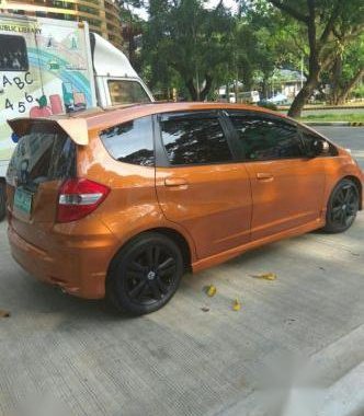 Selling Orange Honda Jazz 2013 in Quezon City