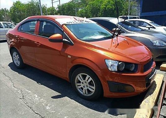 Orange Chevrolet Sonic 2015 at 30303 km for sale 