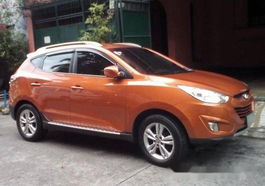 Orange Hyundai Tucson 2013 at 39125 km for sale