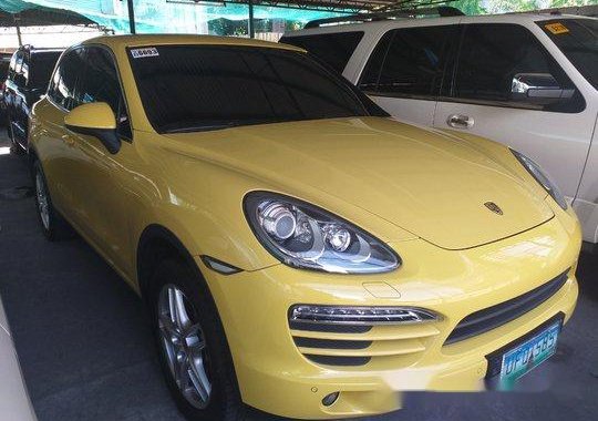 Yellow Porsche Cayenne 2012 at 14000 km for sale