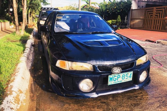 Selling Blue Mitsubishi Lancer 1999 in Quezon City 