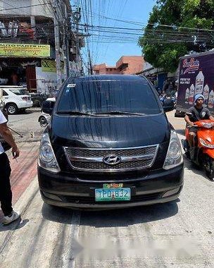 Black Hyundai Grand Starex 2011 at 85000 km for sale 