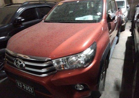 Selling Orange Toyota Hilux 2017 in Makati 