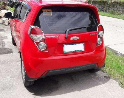 Red 2013 Chevrolet Spark at 65000 km for sale in Pampanga 