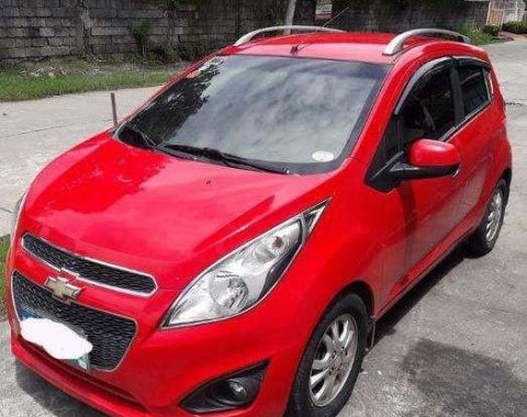 Red 2013 Chevrolet Spark at 65000 km for sale in Pampanga 