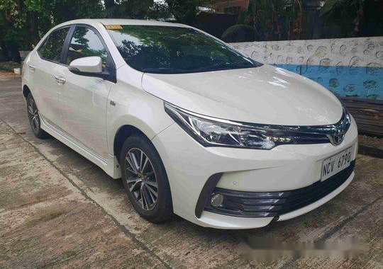 Selling White Toyota Corolla Altis 2018 Automatic Gasoline at 7000 km 