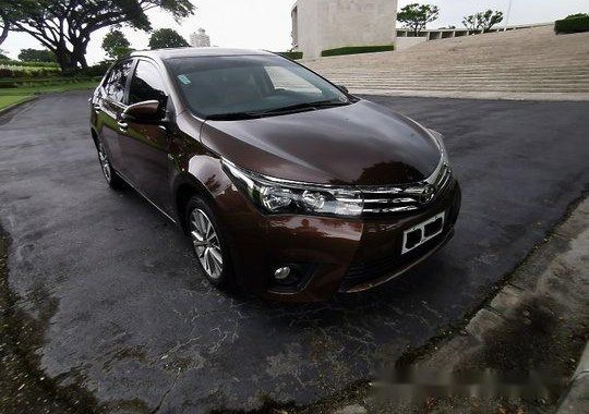 Sell Brown 2014 Toyota Corolla Altis Automatic Gasoline 