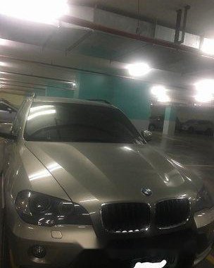Selling Silver Bmw X5 2010 at 57000 km 