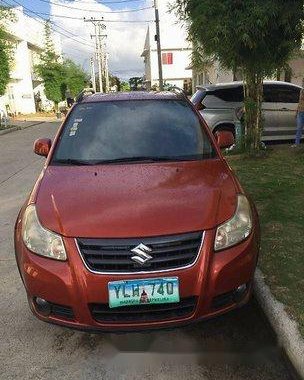 Orange Suzuki Sx4 2014 at 65000 km for sale in Manila