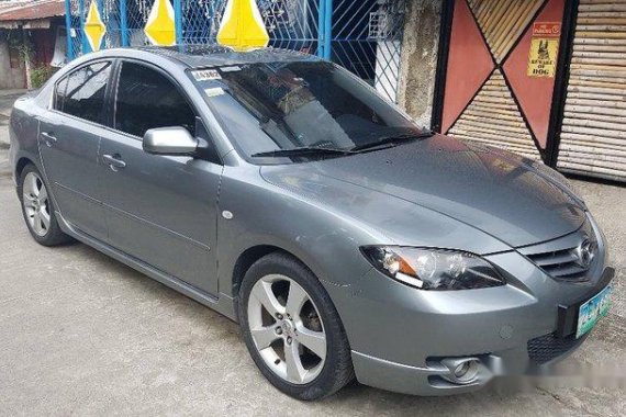 Selling Grey Mazda 323 2006 at 65000 km 