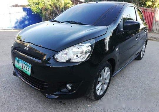 Selling Black Mitsubishi Mirage 2014 at 26000 km