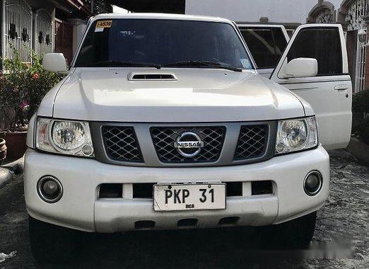White Nissan Patrol 2013 at 157000 km for sale 