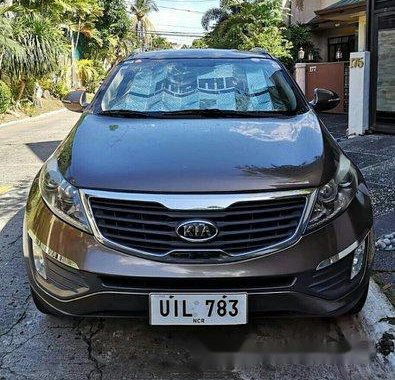 Selling Brown Kia Sportage 2012 Automatic Gasoline at 68000 km 