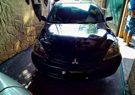 Black Mitsubishi Lancer 2010 for sale in Quezon City