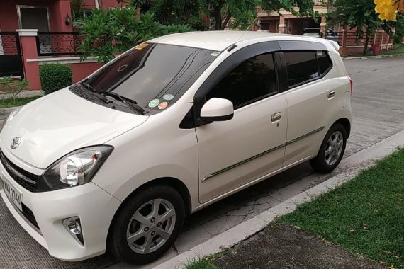 Pearlwhite Toyota Wigo 2014 for sale in Malolos