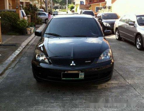 Sell Black 2009 Mitsubishi Lancer in Quezon City