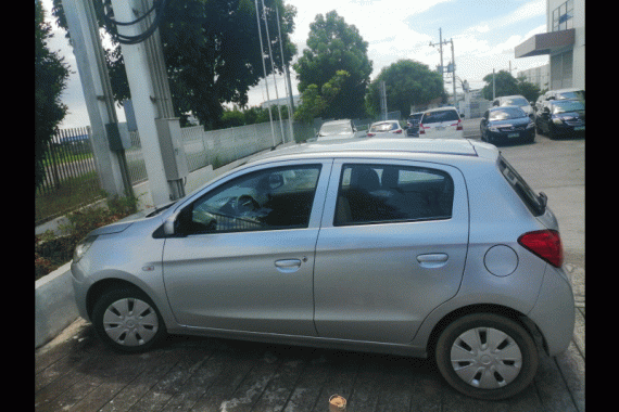 Silver Mitsubishi Mirage 2014 Hatchback for sale in Makati City 