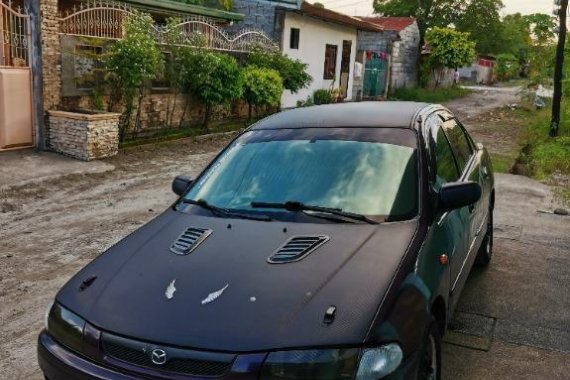 Black Mazda Protege for sale in Dau