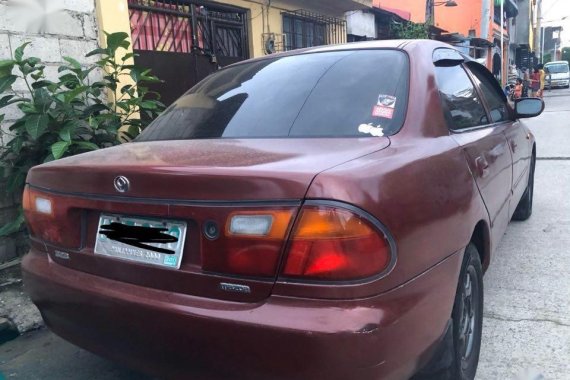 Sell Purple Mazda Familia in Caloocan