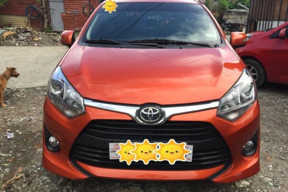 Selling Orange Toyota Wigo in Dasmariñas