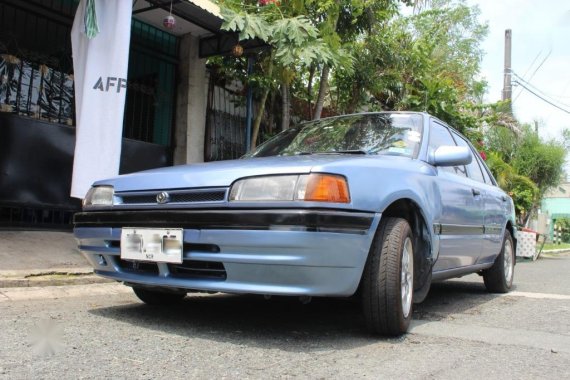 Selling Blue Mazda 323 in Las Piñas