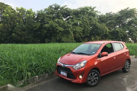 Orange Toyota Wigo for sale in Quezon City