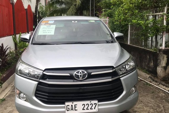 SILVER METALLIC TOYOTA INNOVA 2.8 E M/T 2018 with Franchise and Airport Sticker 