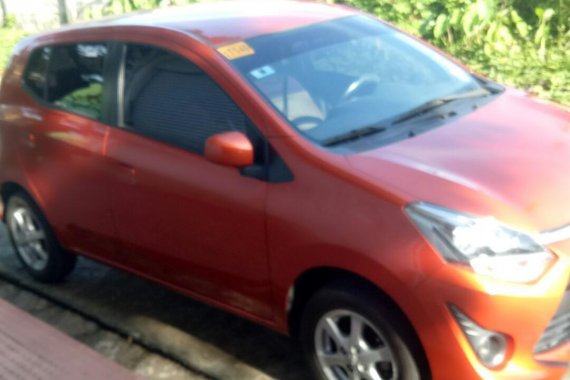 Selling Orange Toyota Wigo in Apalit