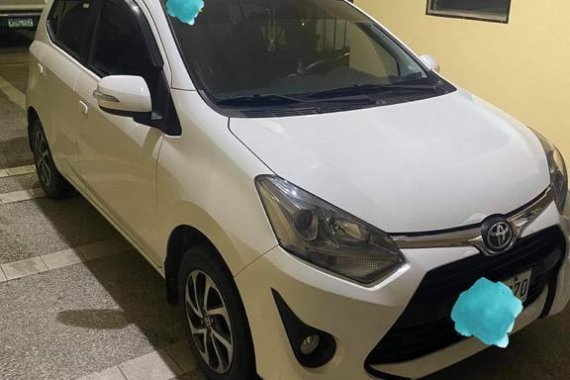 Pearl White Toyota Wigo for sale in Quezon 