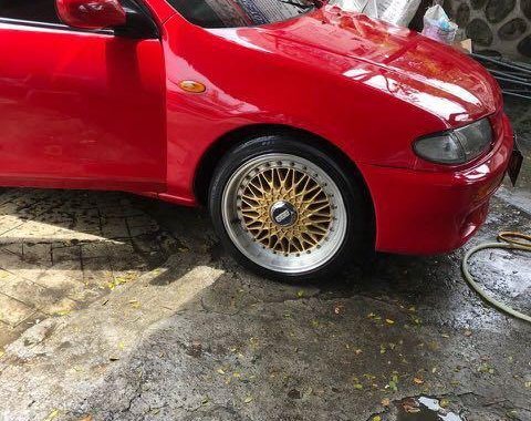 Red Mazda 323 1996 for sale in Quezon City